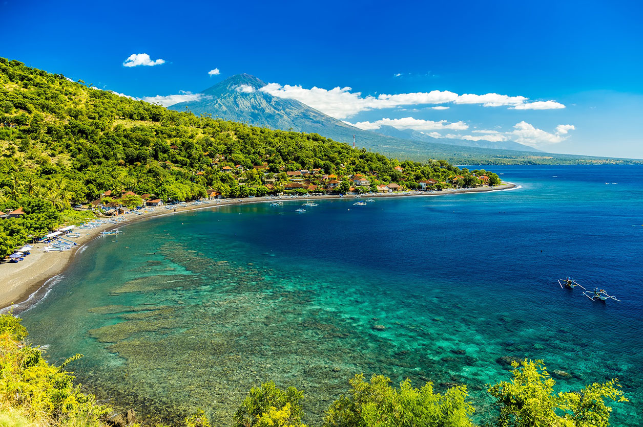 Dive boats wait at the dock on Menjangan Island, Bali, before taking SCUBA tourists out on the magnificent reefs in Bali Barat National Park.
